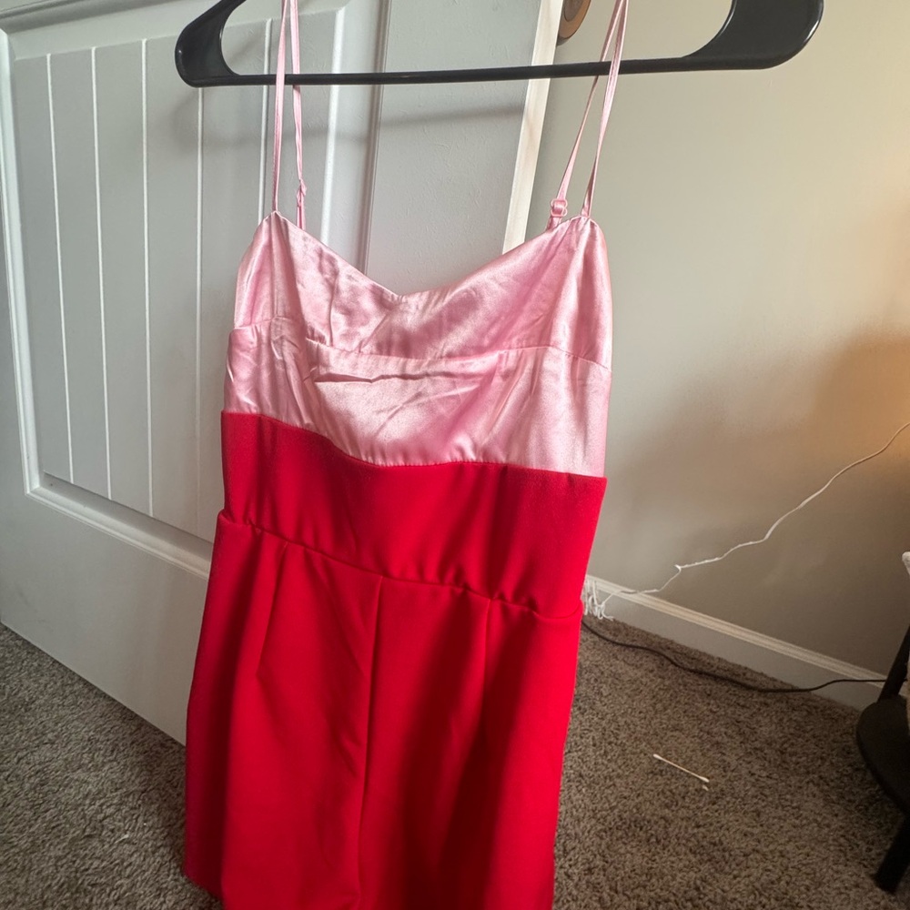 Franchescas red romper with pink silk detail